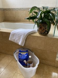 epsom salt or apple cider vinegar used in a bucket oot bath