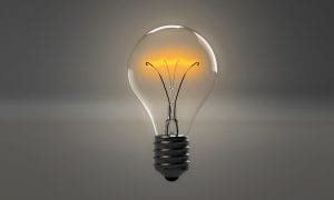 a bright lightbulb represents inspiration, an idea, a possibility